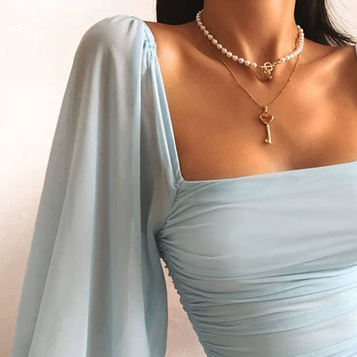 Vendra | Bodycon Mini Dress with Puff Sleeves – Light Blue